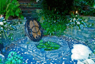 Rowanthwaite Wishing well A cream envelope and a floral invitation